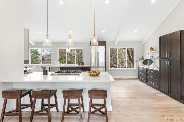 a kitchen with refrigerator and window
