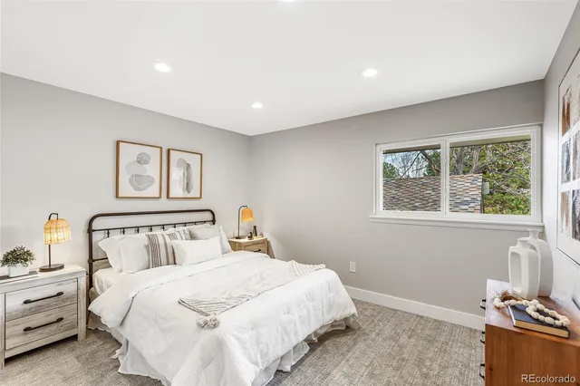 a bedroom with bed and window