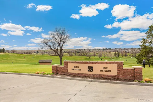 a front view of a house with a yard and outdoor seating