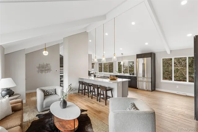 a large kitchen with a table and chairs