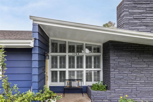 a front view of a house with a large windows