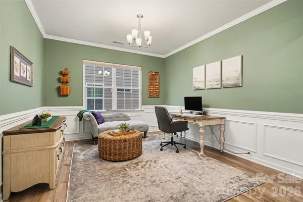 a workspace with furniture and a window