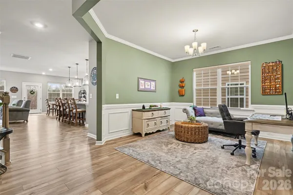 a living room with furniture and a table