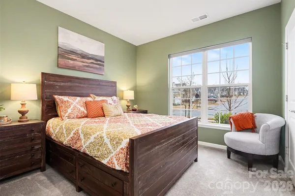 a bed room with a bed and a couch