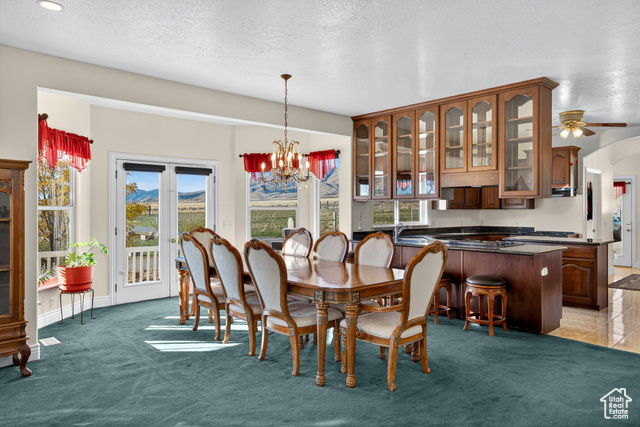 4768 East Hickman Canyon Road Stockton, UT 84071 - Photo 17 of 85 Dining area featuring a chandelier, French doors to porch.