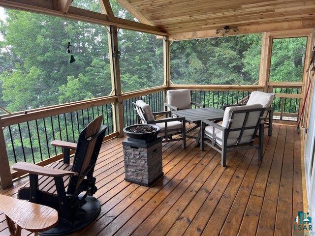 444 Fernberg Road, Unit 11 Ely, MN 55731 - Photo 14 of 19 Sunroom with a wealth of natural light