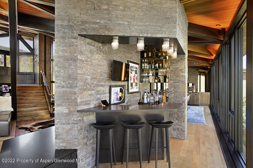 27 Turkey Trot Court Snowmass Village, CO 81615 - Photo 15 of 45 a front view of a house with outdoor seating