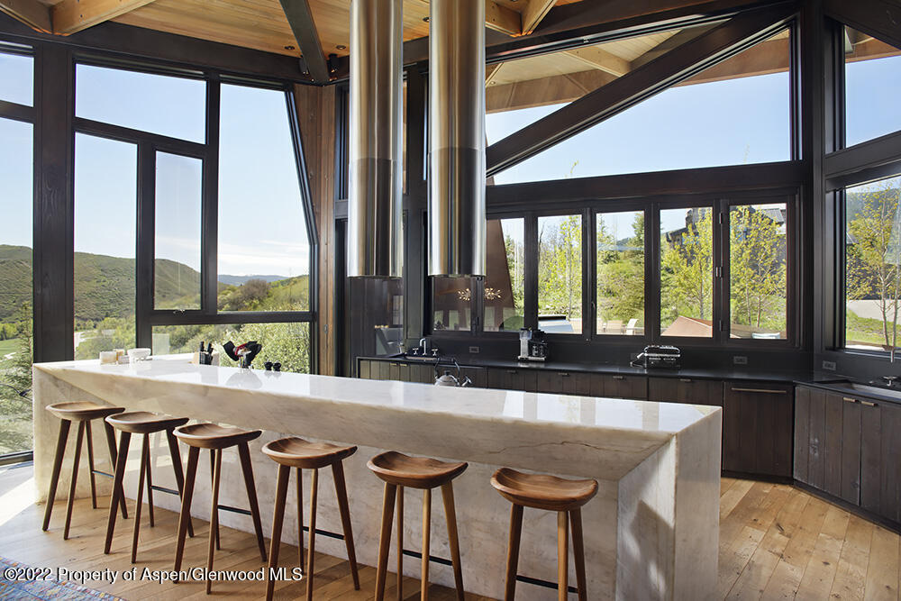 27 Turkey Trot Court Snowmass Village, CO 81615 - Photo 16 of 45 a room with furniture and large windows