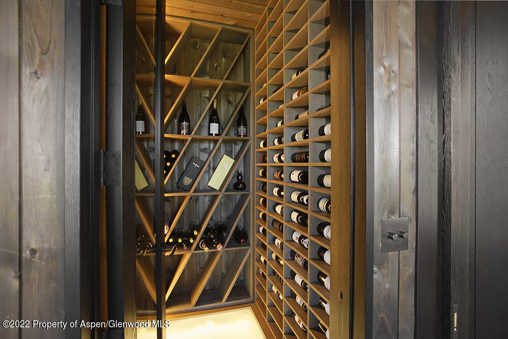 27 Turkey Trot Court Snowmass Village, CO 81615 - Photo 20 of 45 a view of an empty room with wooden floor