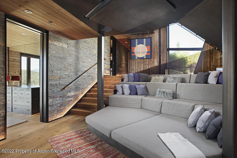 27 Turkey Trot Court Snowmass Village, CO 81615 - Photo 22 of 45 a living room with furniture and a large window