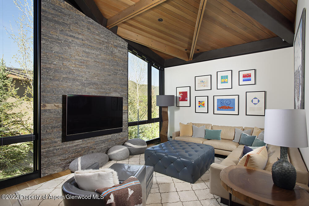 27 Turkey Trot Court Snowmass Village, CO 81615 - Photo 25 of 45 a living room with furniture and a fireplace