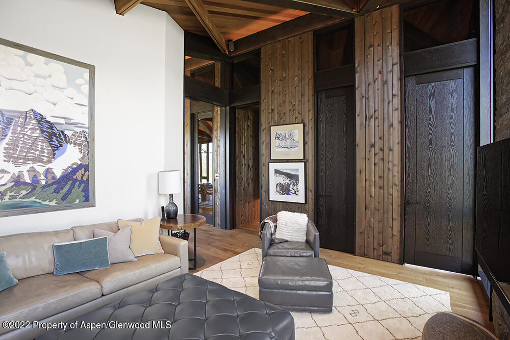 27 Turkey Trot Court Snowmass Village, CO 81615 - Photo 26 of 45 a living room with furniture and a painting on the wall