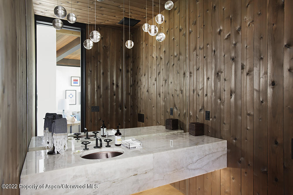 27 Turkey Trot Court Snowmass Village, CO 81615 - Photo 27 of 45 a bathroom with a sink vanity and a mirror