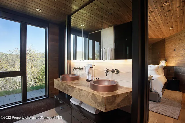 a bathroom with a shower and a mirror