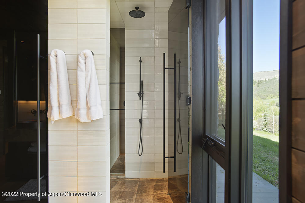 27 Turkey Trot Court Snowmass Village, CO 81615 - Photo 35 of 45 a bathroom with a shower and a mirror