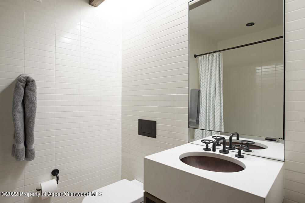 27 Turkey Trot Court Snowmass Village, CO 81615 - Photo 39 of 45 a bathroom with a sink and a mirror