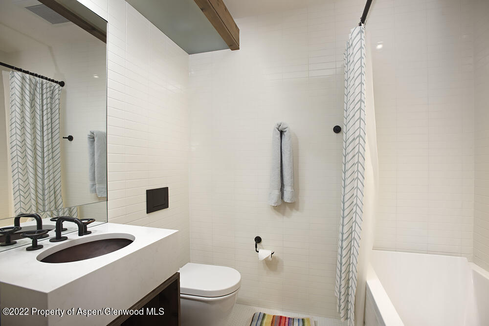27 Turkey Trot Court Snowmass Village, CO 81615 - Photo 41 of 45 a bathroom with a sink a toilet and a bathtub