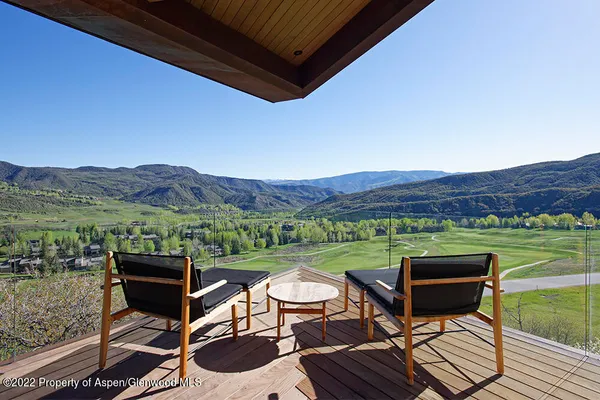 a view of a chairs and table on the terrace