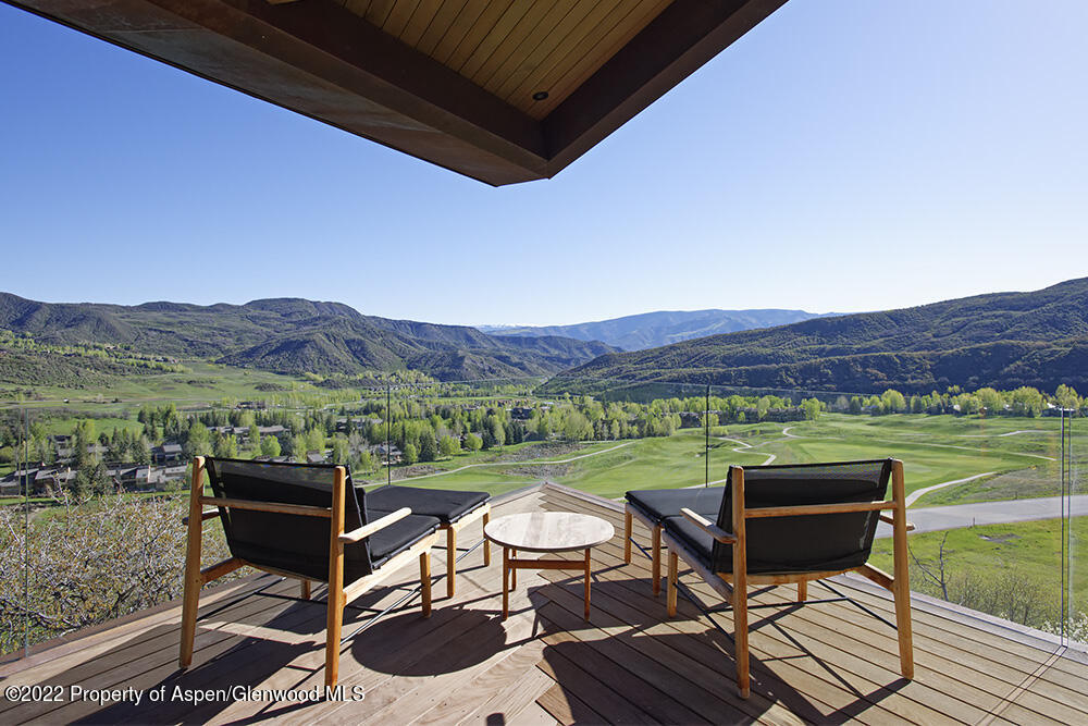 27 Turkey Trot Court Snowmass Village, CO 81615 - Photo 7 of 45 a view of a chairs and table on the terrace
