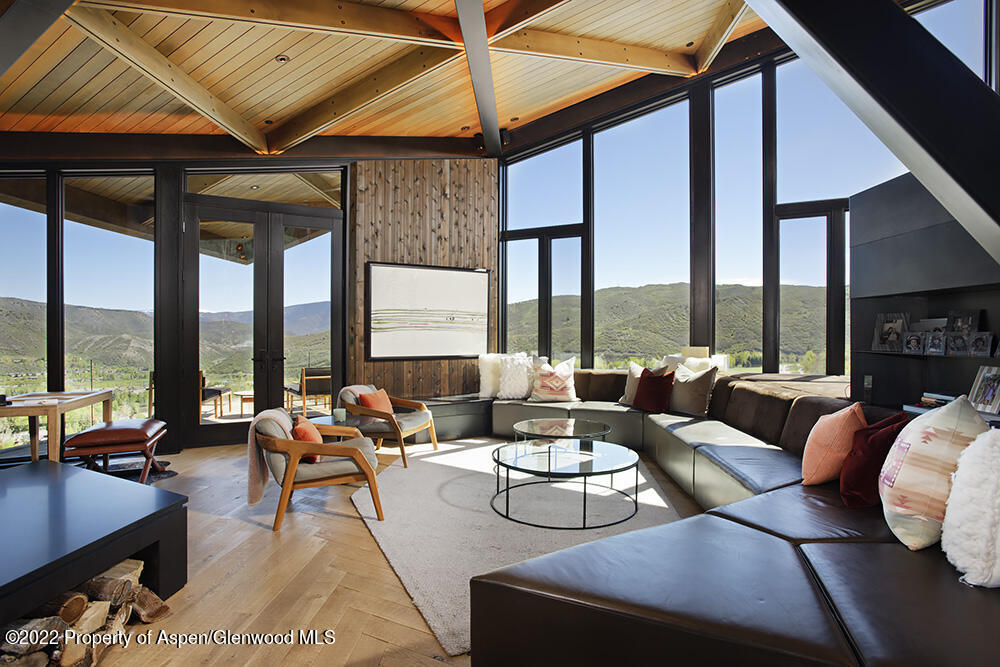 27 Turkey Trot Court Snowmass Village, CO 81615 - Photo 9 of 45 a living room with furniture and a large window