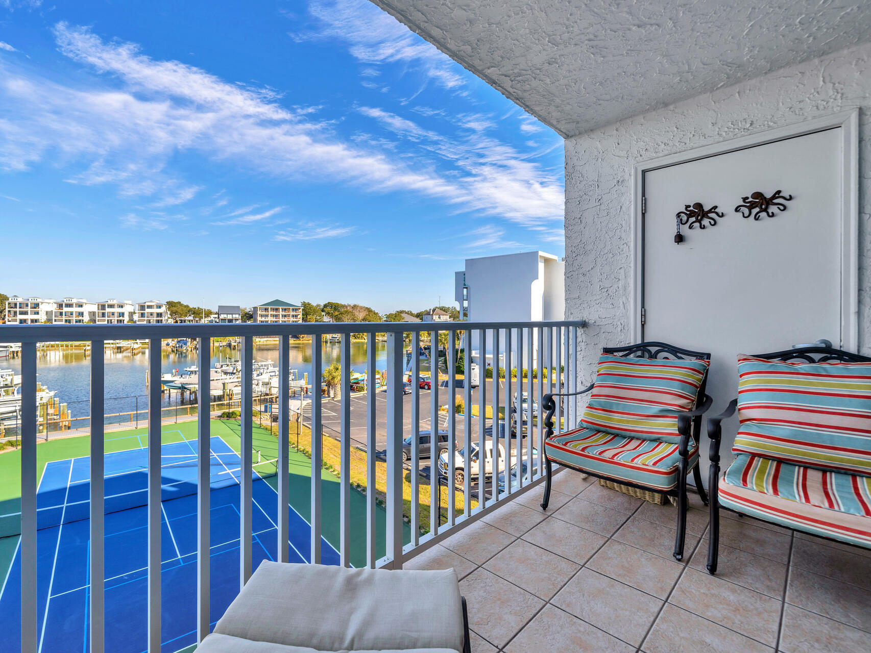 30 Moreno Point Road, Unit 403A Destin, FL 32541 - Photo 17 of 33 a bedroom with furniture and a window