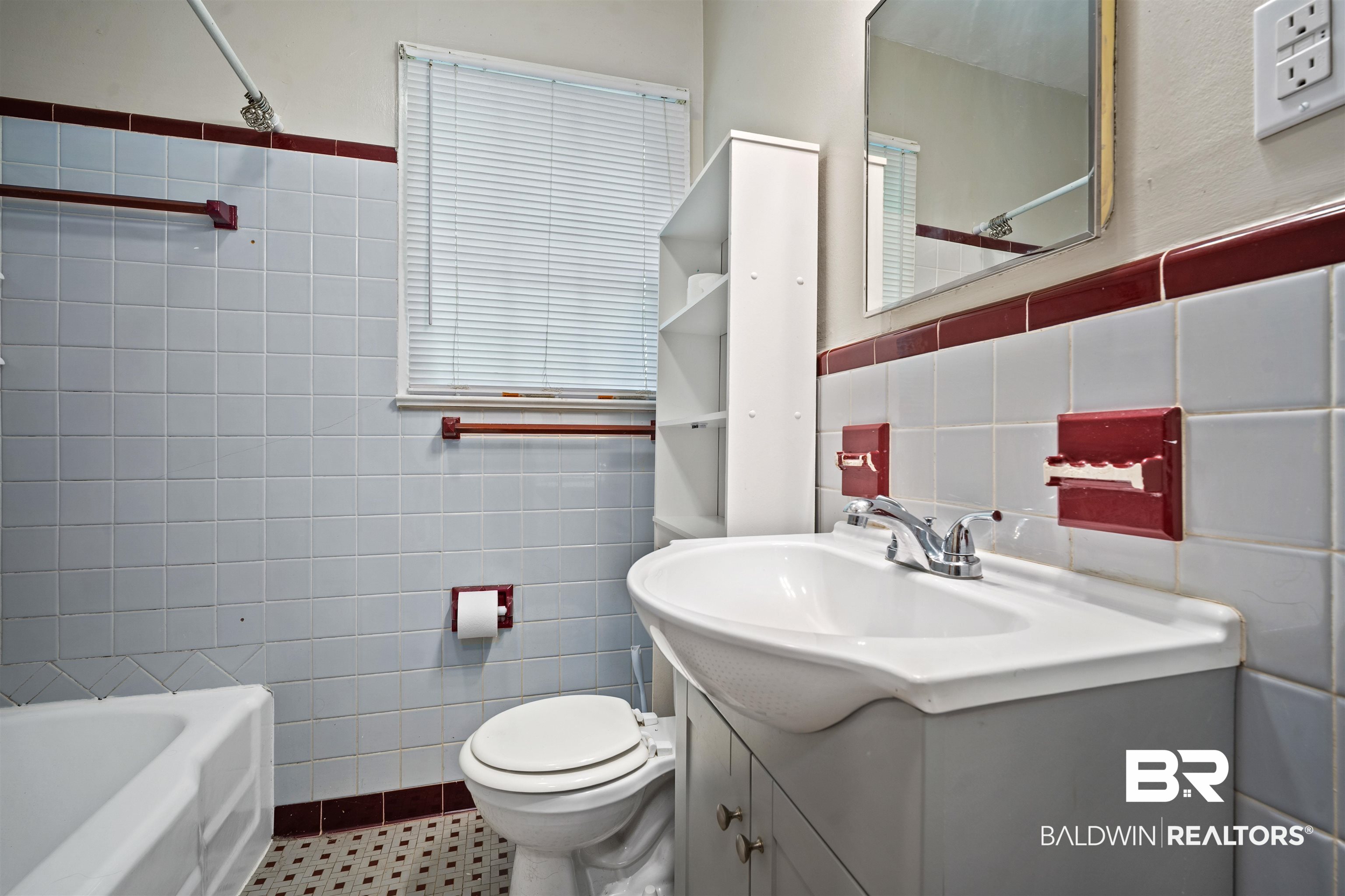 9 Elizabeth Avenue Mobile, AL 36611 - Photo 13 of 19 Bathroom featuring tile walls, vanity, a wainscoted wall, and bathtub / shower combination