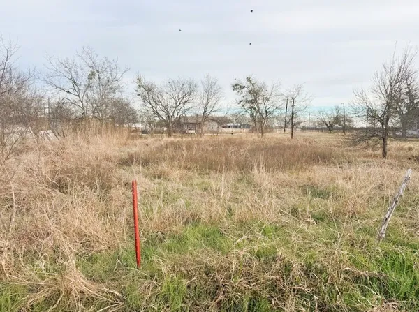 a view of a lake with a yard