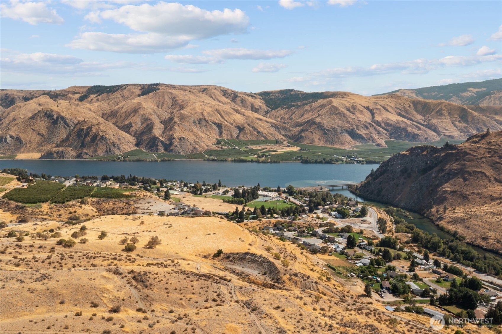 0 Entiat River Road, Unit LOT 5 Entiat, WA 98822 - Photo 33 of 36 a view of a lake with mountains in the background