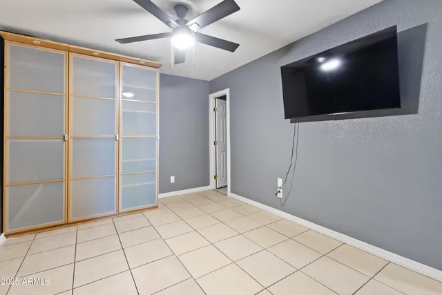 a view of a livingroom with an empty space and a flat screen tv