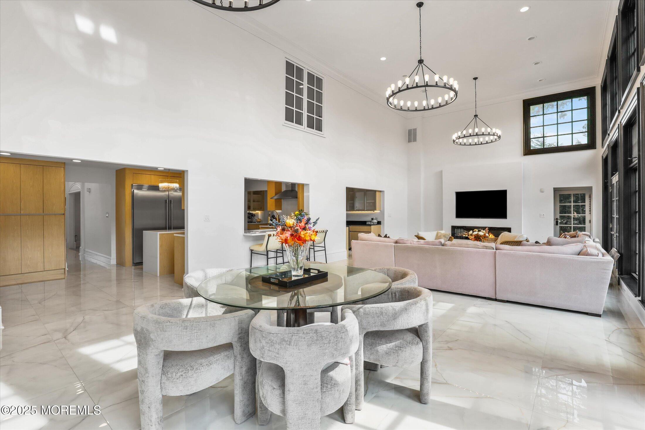 13 Valley Forge Road Eatontown, NJ 07724 - Photo 30 of 74 a living room with furniture kitchen view and a flat screen tv
