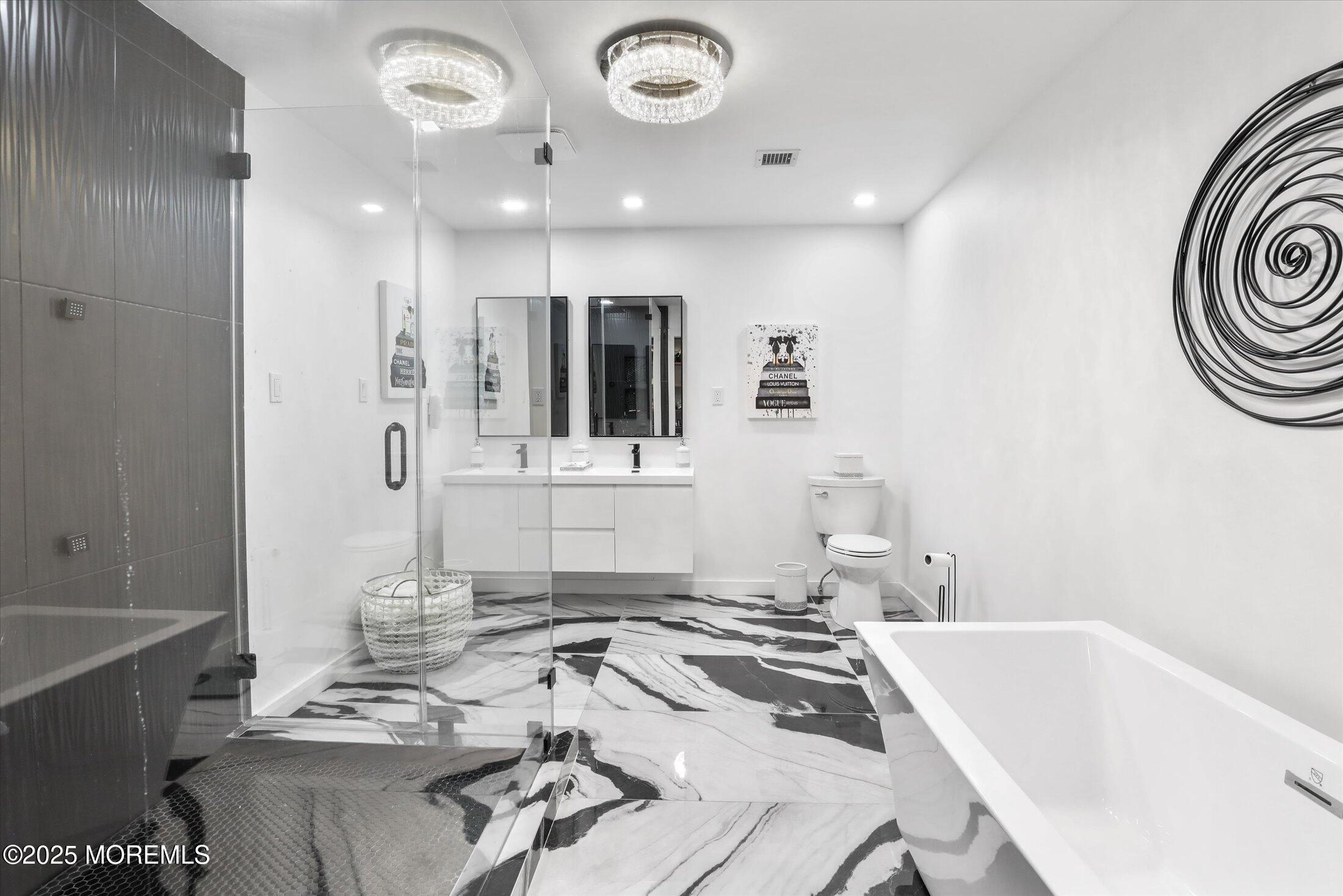 13 Valley Forge Road Eatontown, NJ 07724 - Photo 40 of 74 a bathroom with a tub sink and mirror