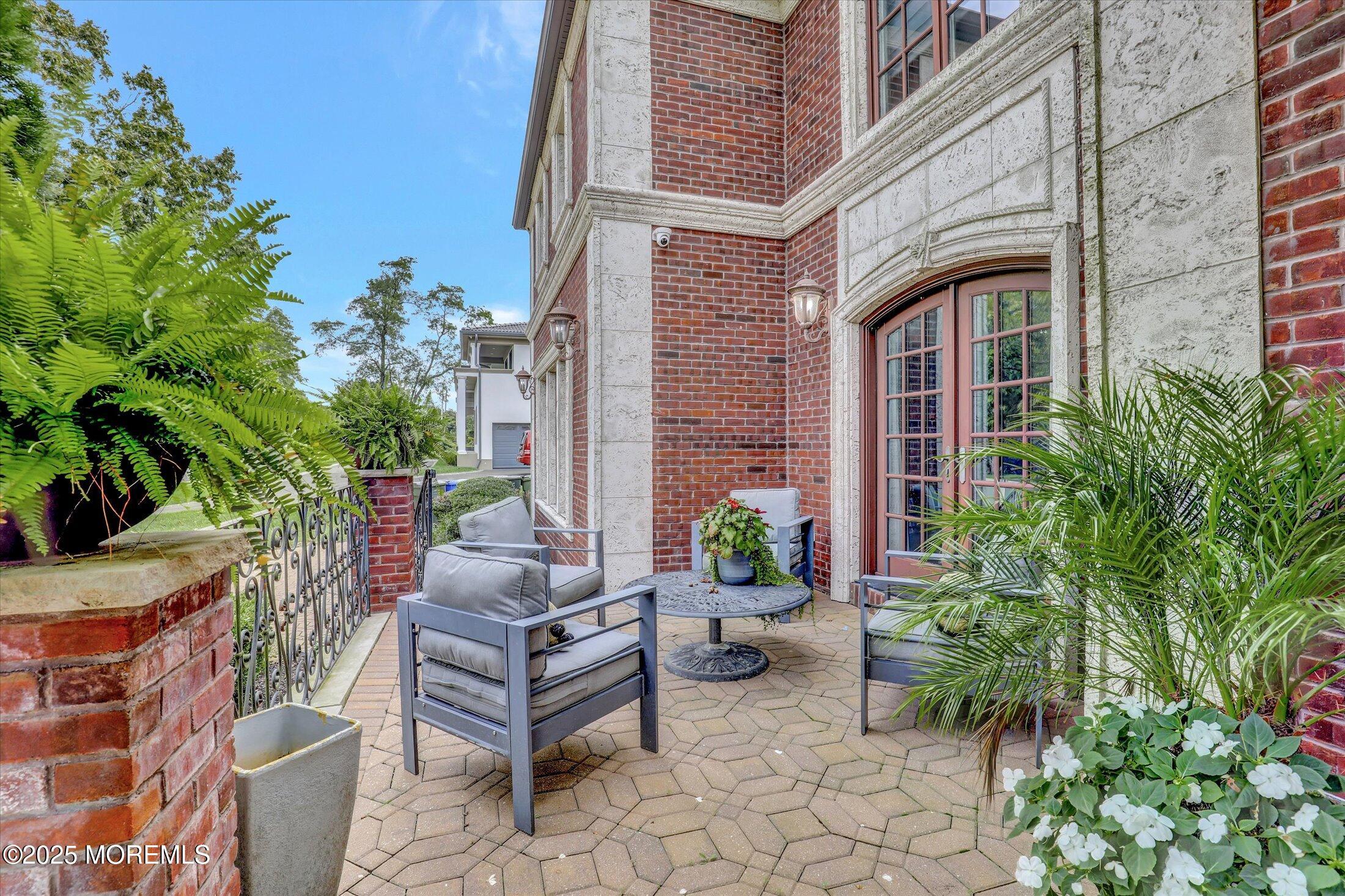 13 Valley Forge Road Eatontown, NJ 07724 - Photo 9 of 74 a view of a patio with plants and chairs potted plants