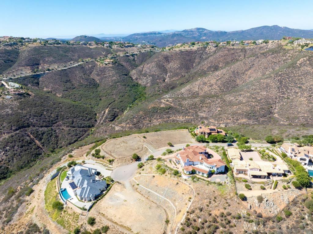 17928 El Brazo Rancho Santa Fe, CA 92067 - Photo 21 of 36 an aerial view of a house with a mountain
