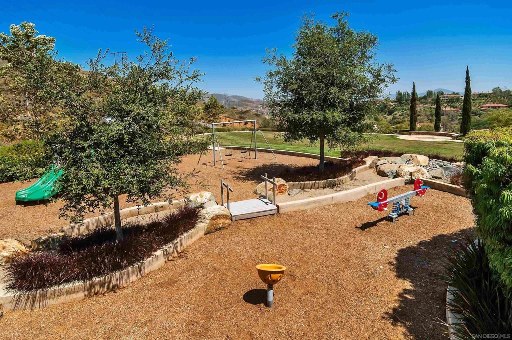 17928 El Brazo Rancho Santa Fe, CA 92067 - Photo 35 of 36 a view of a lake with a yard