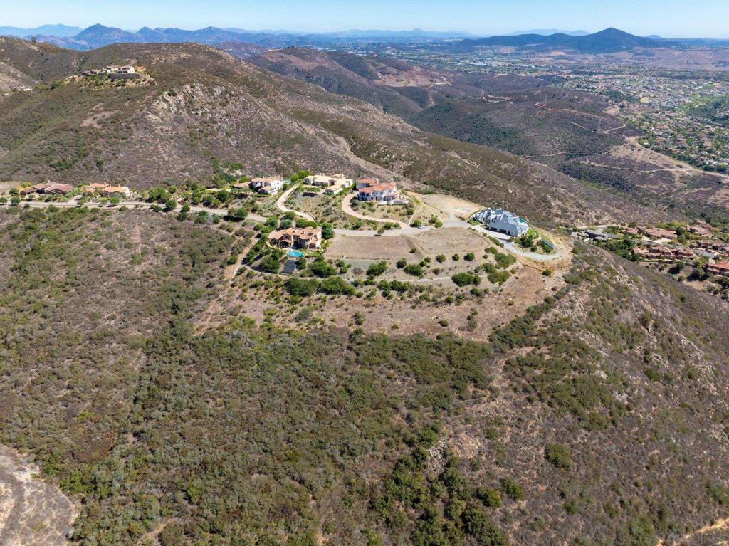 17928 El Brazo Rancho Santa Fe, CA 92067 - Photo 9 of 36 a view of a field with mountains in the background