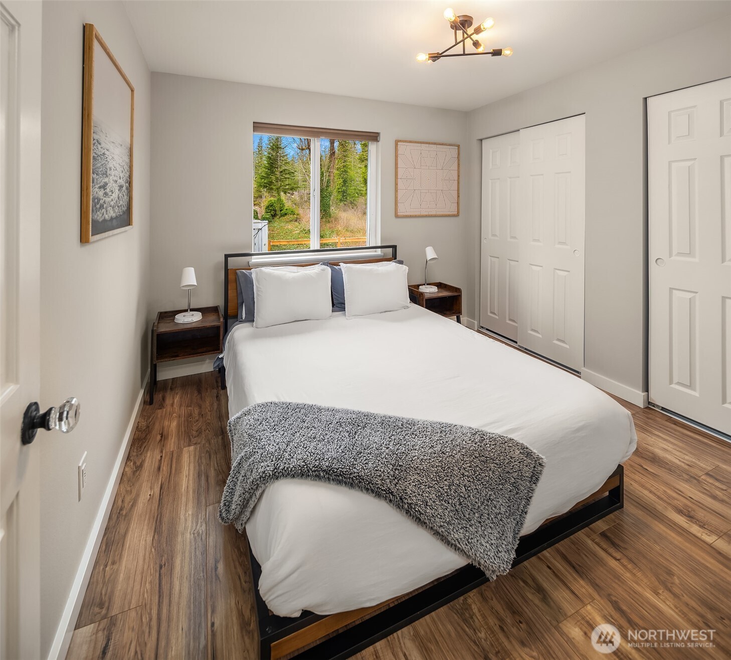 44103 Fir Road Gold Bar, WA 98251 - Photo 11 of 26 a bedroom with a bed and wooden floor