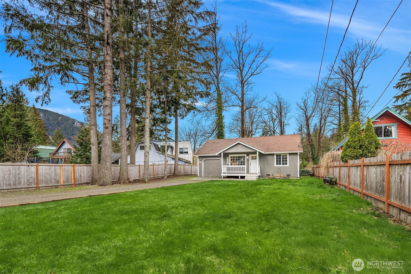 44103 Fir Road Gold Bar, WA 98251 - Photo 13 of 26 a view of an house with backyard and a tree