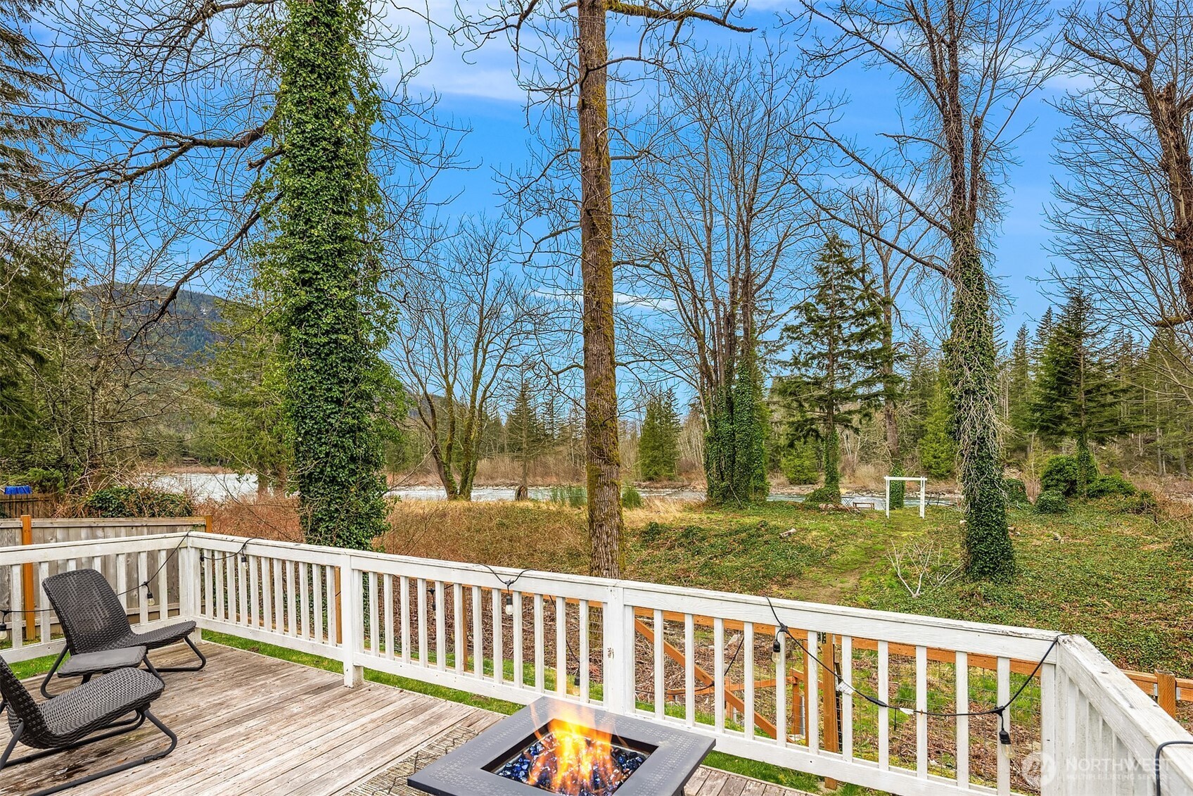 44103 Fir Road Gold Bar, WA 98251 - Photo 16 of 26 a view of a wooden deck with trees