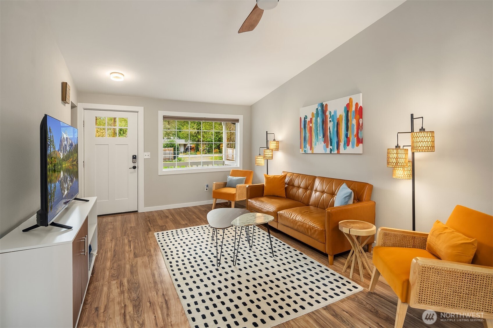 44103 Fir Road Gold Bar, WA 98251 - Photo 5 of 26 a living room with furniture and a flat screen tv