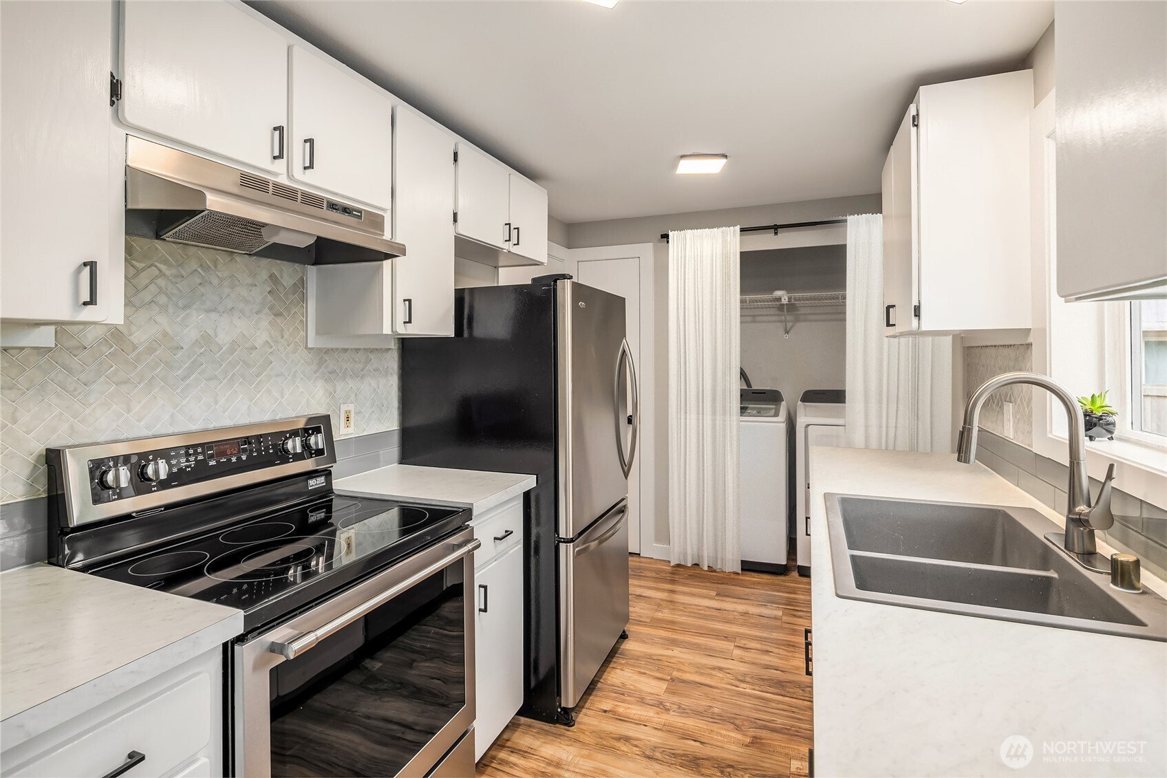 44103 Fir Road Gold Bar, WA 98251 - Photo 7 of 26 a kitchen with stainless steel appliances a refrigerator a sink and a stove