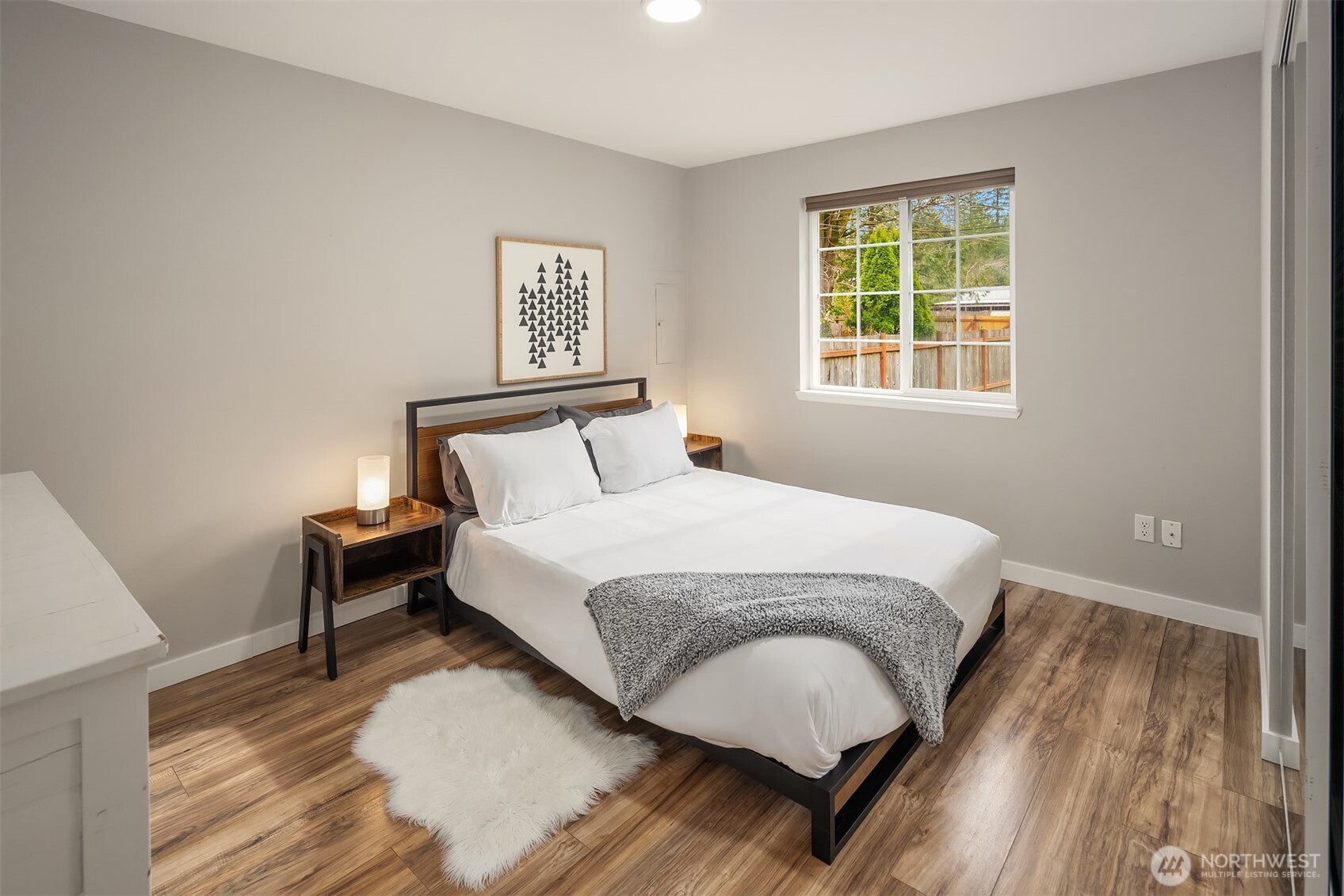 44103 Fir Road Gold Bar, WA 98251 - Photo 9 of 26 a bedroom with a bed lamp and a window