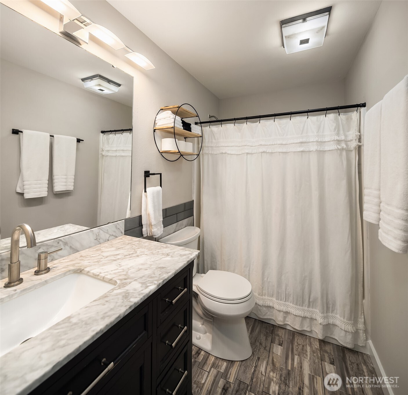 44103 Fir Road Gold Bar, WA 98251 - Photo 10 of 26 a bathroom with a granite countertop sink toilet and shower