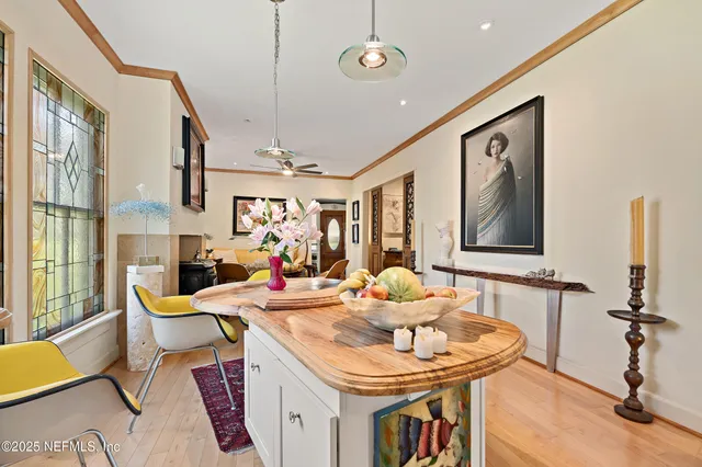 a living room with furniture a window and a table