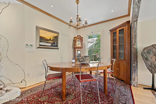 an aerial view of a house with a yard and lake view