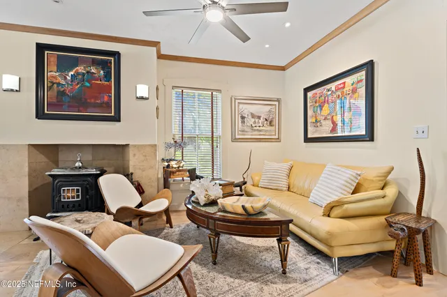 a view of a dining room with furniture and a chandelier
