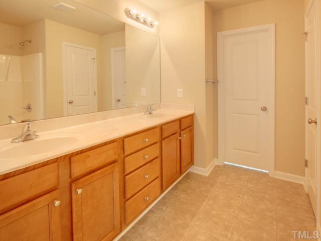 5022 Jelynn Street Raleigh, NC 27616 - Photo 11 of 18 Large master bath with his/her sinks! Plenty of storage space under the sink and a great linen closet! Enjoy the privacy of this master bath!