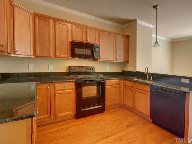 5022 Jelynn Street Raleigh, NC 27616 - Photo 7 of 18 Become a master chef in your new kitchen! Hardwood floors and granite counter tops stand out in this open kitchen. Whether your making a quick meal on the run or a feast, this is kitchen for you! Plenty of cabinet and counter top space.