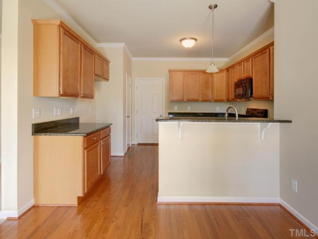 5022 Jelynn Street Raleigh, NC 27616 - Photo 8 of 18 Easy access to the dining room and hallway. Store all your kitchen utensils in the ample cabinet space! Plenty of room for the cook of the house to make wonderful meals!