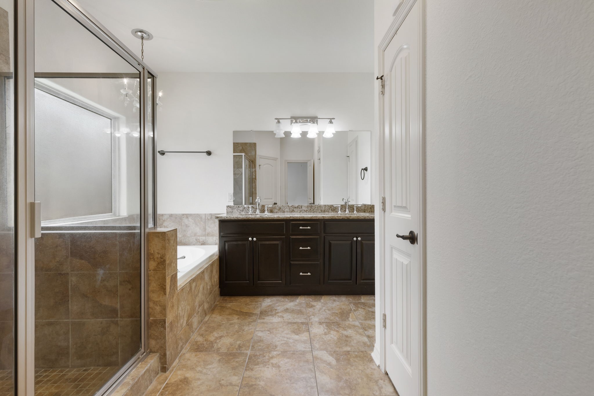 23911 Augusta Falls Lane Spring, TX 77389 - Photo 17 of 40 a bathroom with a granite countertop sink a mirror and a shower