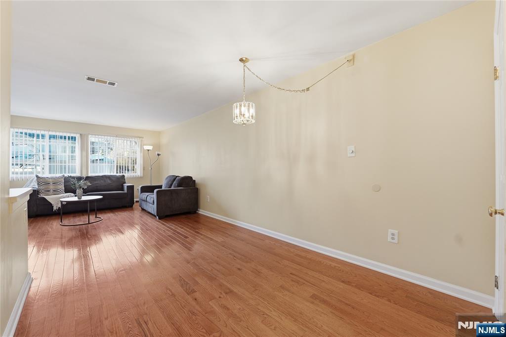 199 Union Avenue, Unit 1G Rutherford, NJ 07070 - Photo 3 of 17 a living room with furniture and a wooden floor